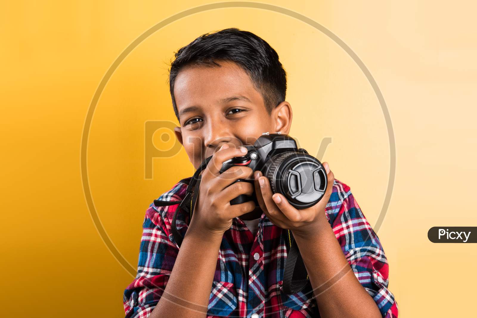 small boy taking pictures with Digital Camera