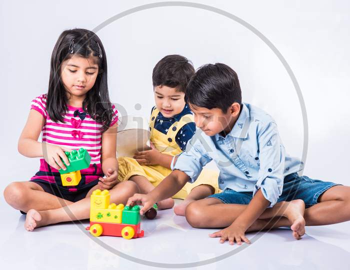 Kids playing with block toys