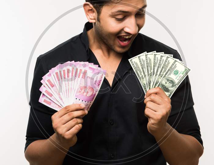 Young man holding cash / money fan / dollars