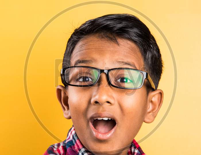 Small boy wears clear eye glasses or spectacles