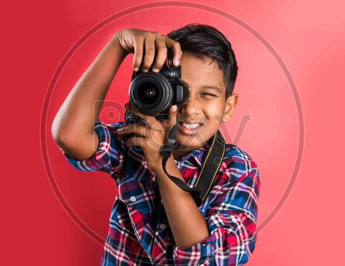 small boy taking pictures with Digital Camera