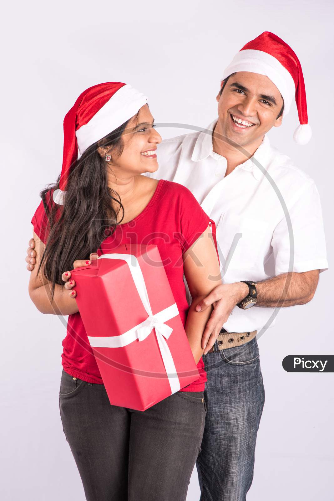 Indian young couple celebrating Christmas / X-mas