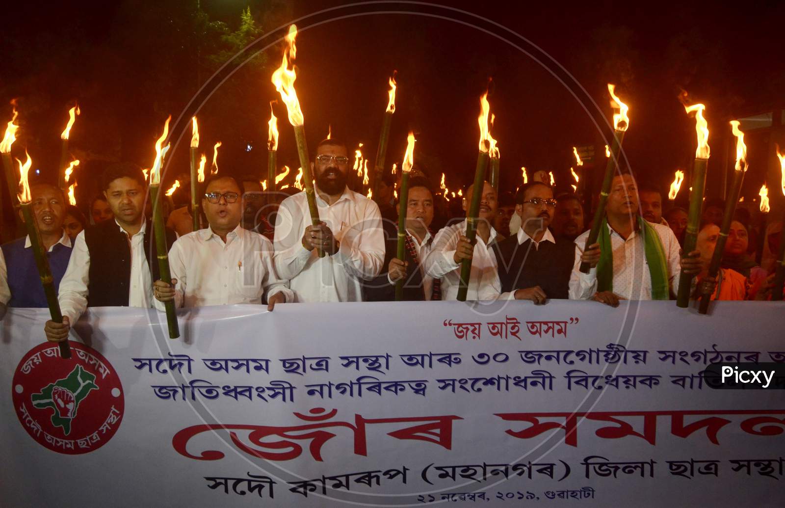 Activists of All Assam Students Union (AASU) taking out a Torch Light procession