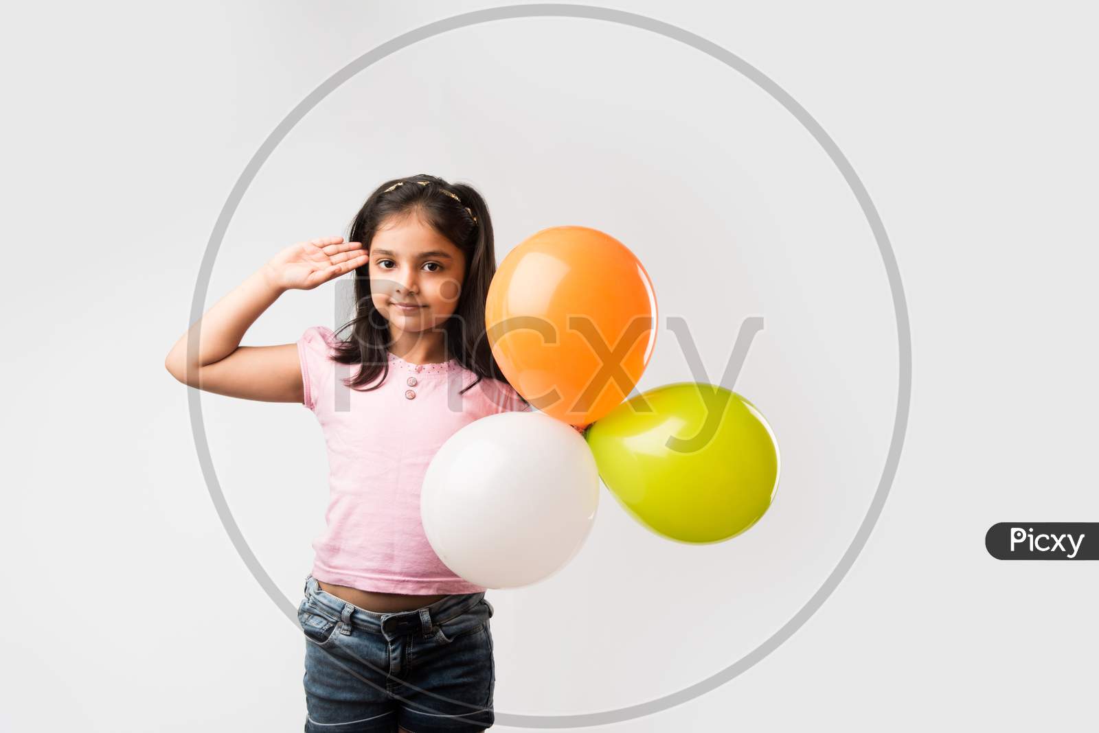 cute little indian girl with tri colour balloons - Saluting national Flag and celebrating Independence or Republic day of India