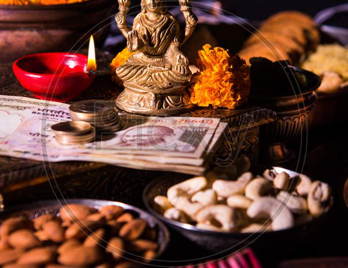 Goddess Laxmi Puja on Diwali with Sweets and Diya