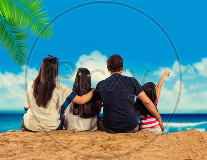 young indian family at beach