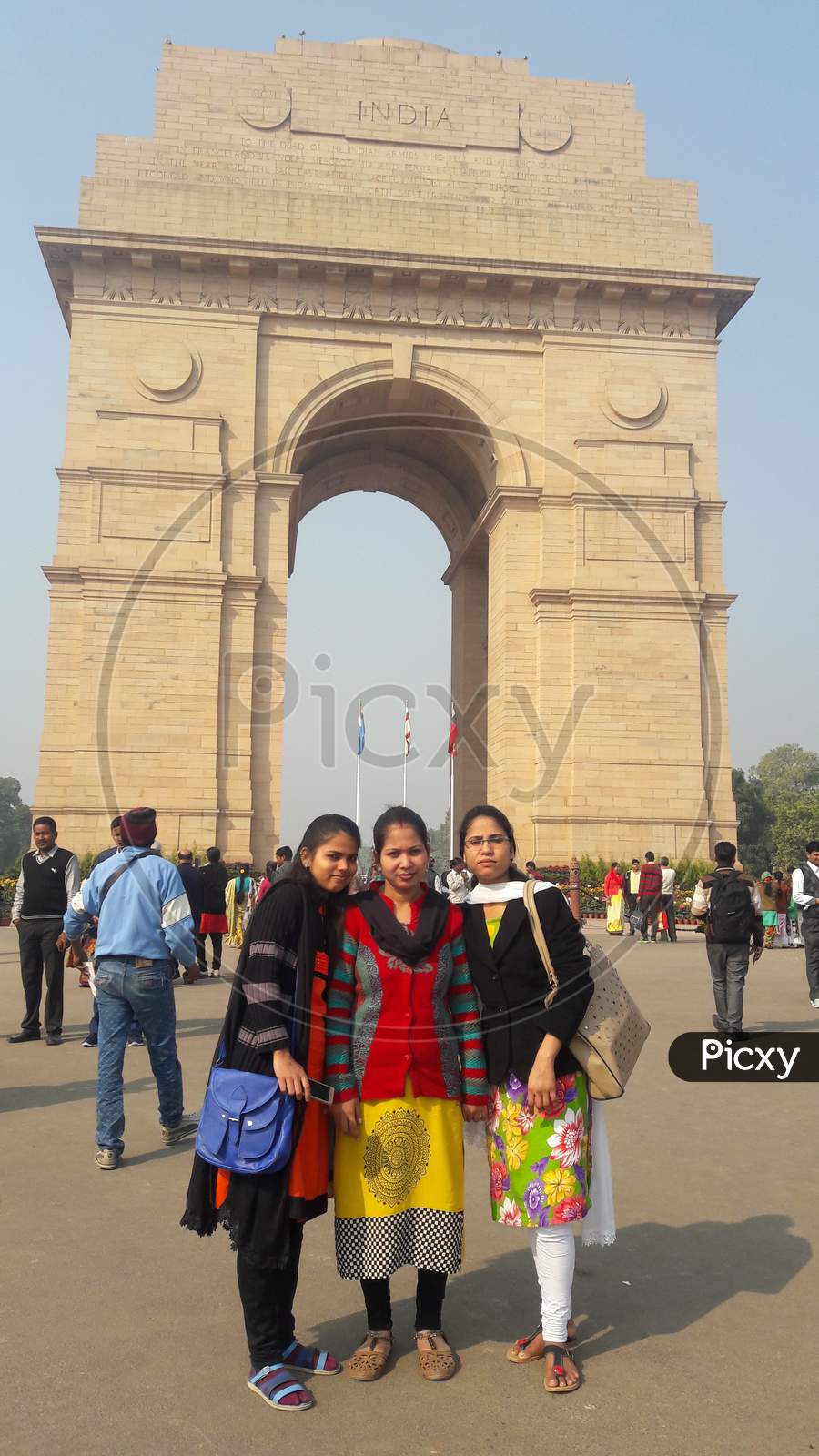 Indian girls together at background India gate