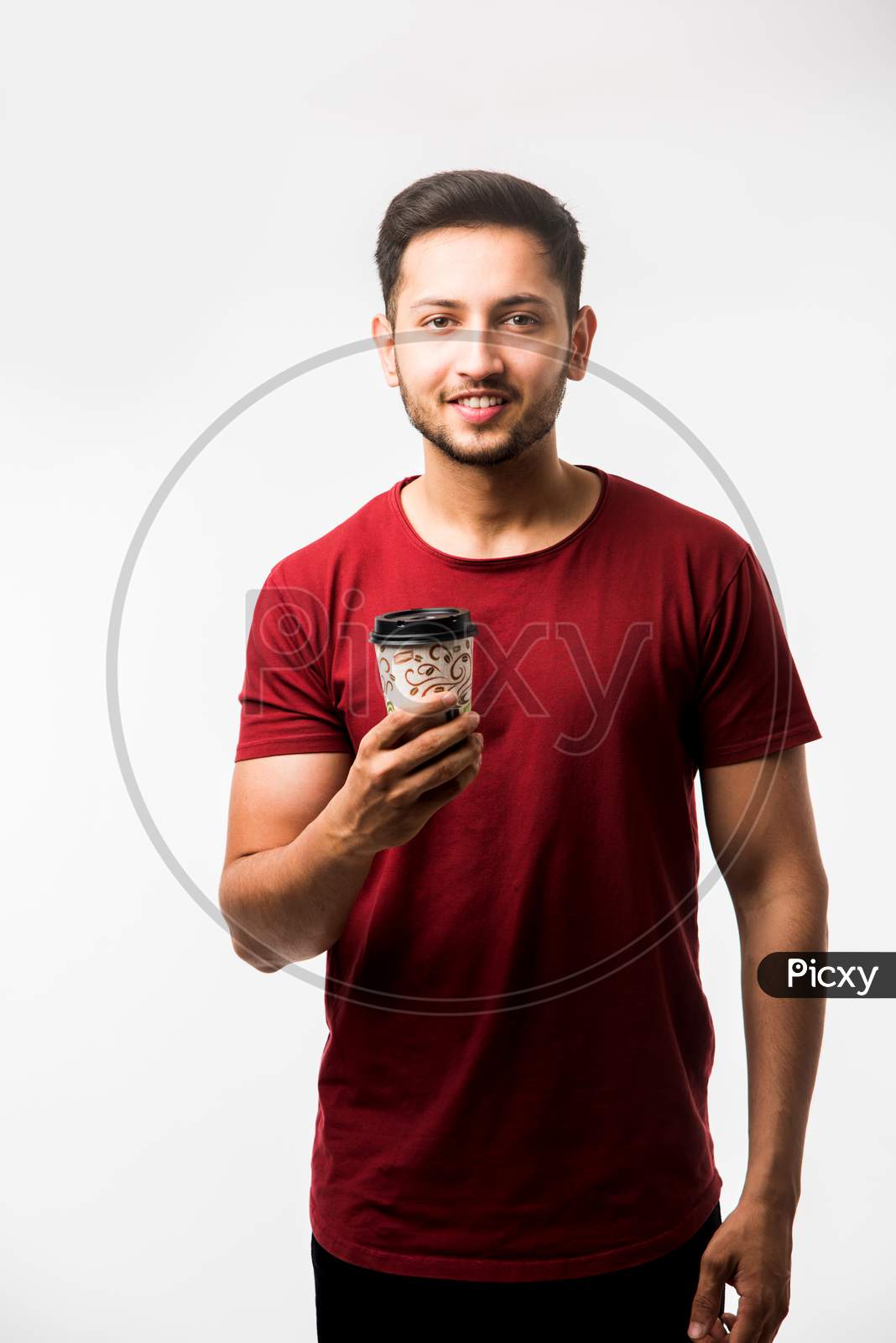 Man having coffee in paper cup