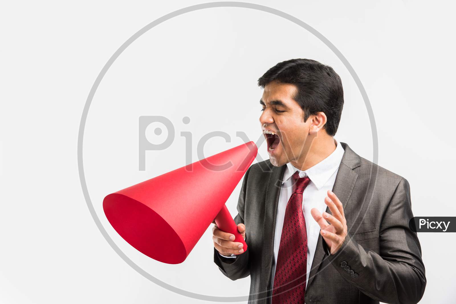 Indian young businessman announcing in paper speaker