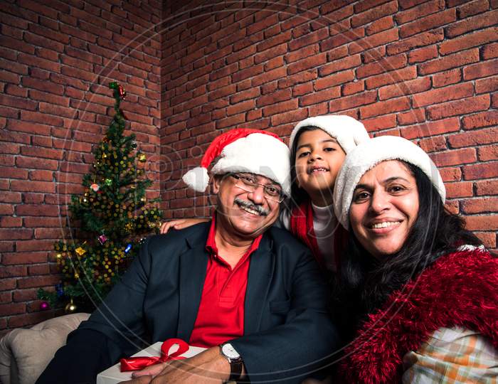 Indian Old couple celebrating Christmas / Xmas