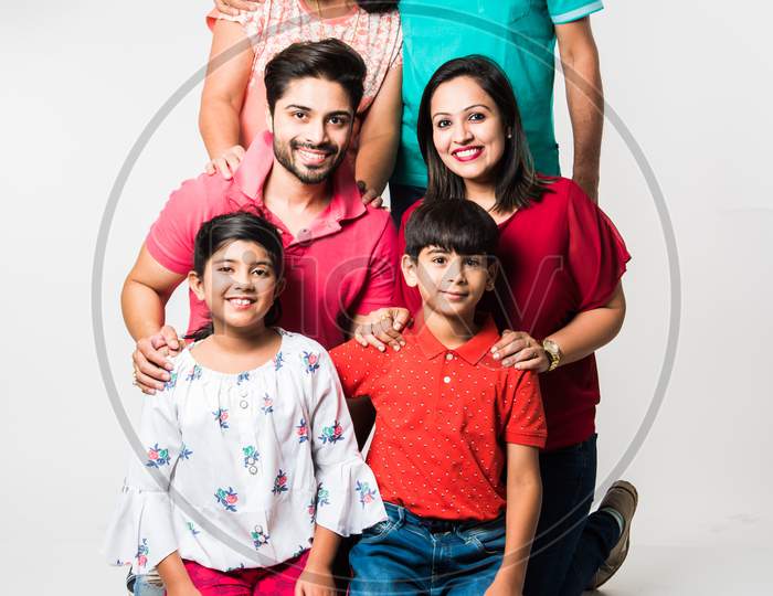 Indian family isolated over white background