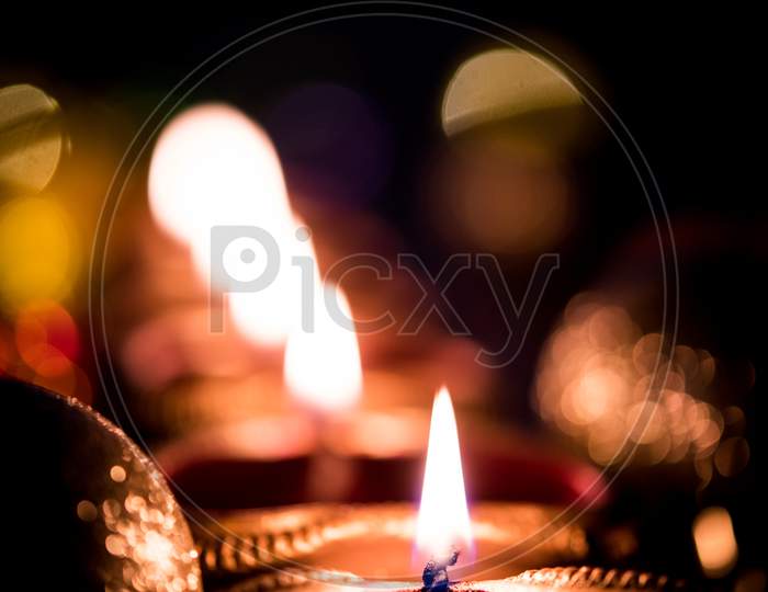 Big Diwali diya over silk cloth - happy diwali greeting card