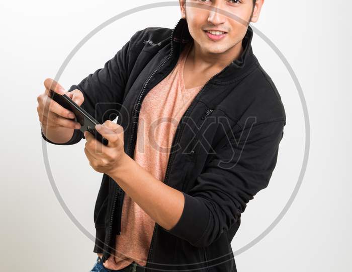 Young man playing game on smartphone