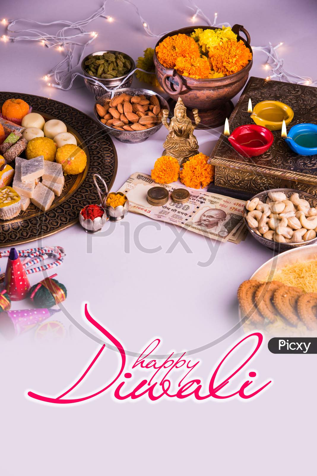 Happy Diwali greeting card showing Goddess Laxmi, sweets etc