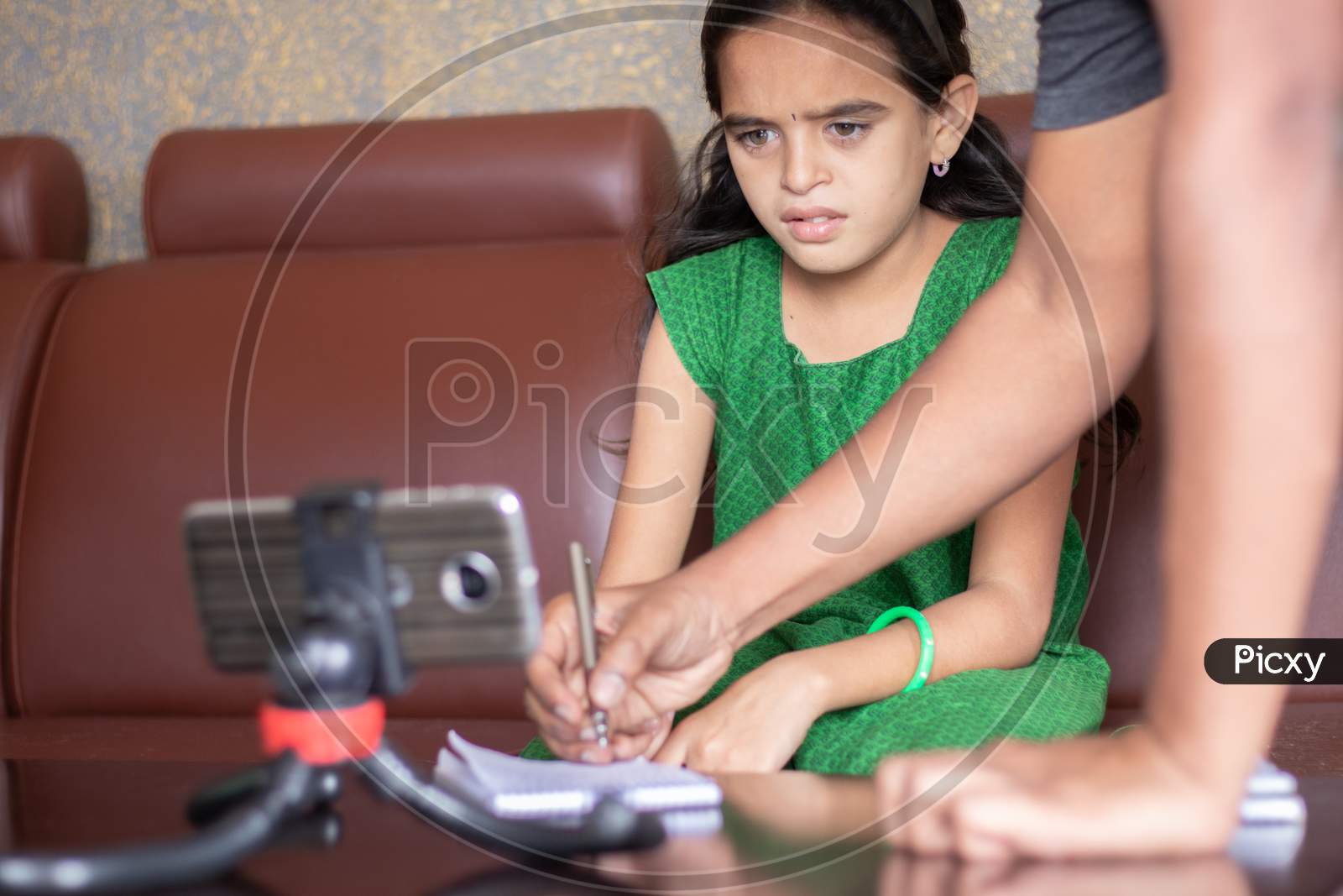 Father Helping Daughter By Solving Problem While Studying The Lesson From Online Class Or E-Learning - Concept Of Role Of Parents In Supporting Child During Homeschooling, Distance Learning.