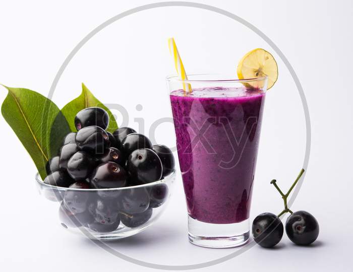 Juice of jamun fruit in a glass also called as java plum, jambolan plum, jambhul, syzygium cumini