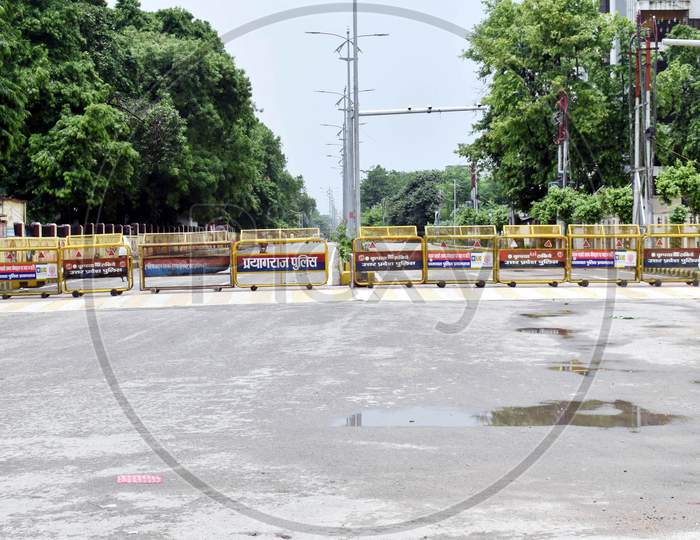 A man rides his bicycle on an empty road during the lockdown in Prayagraj, Uttar Pradesh on July 12, 2020