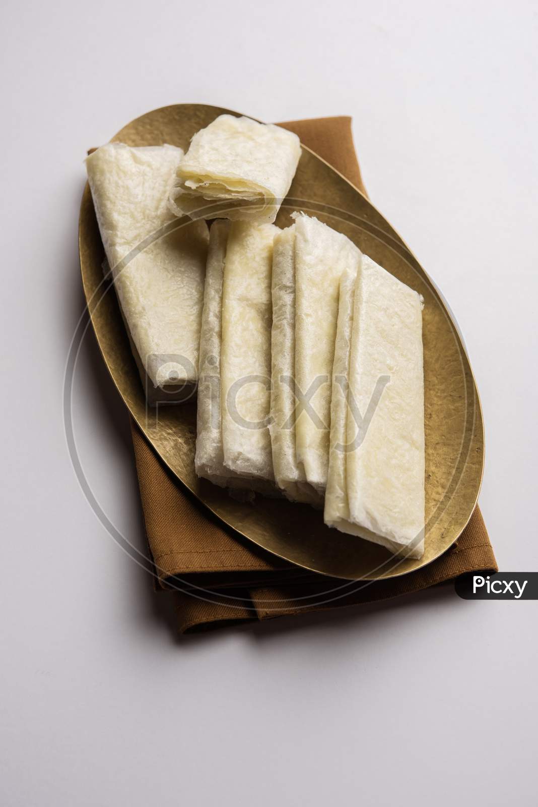 Pootharekulu or paper-thin sweet