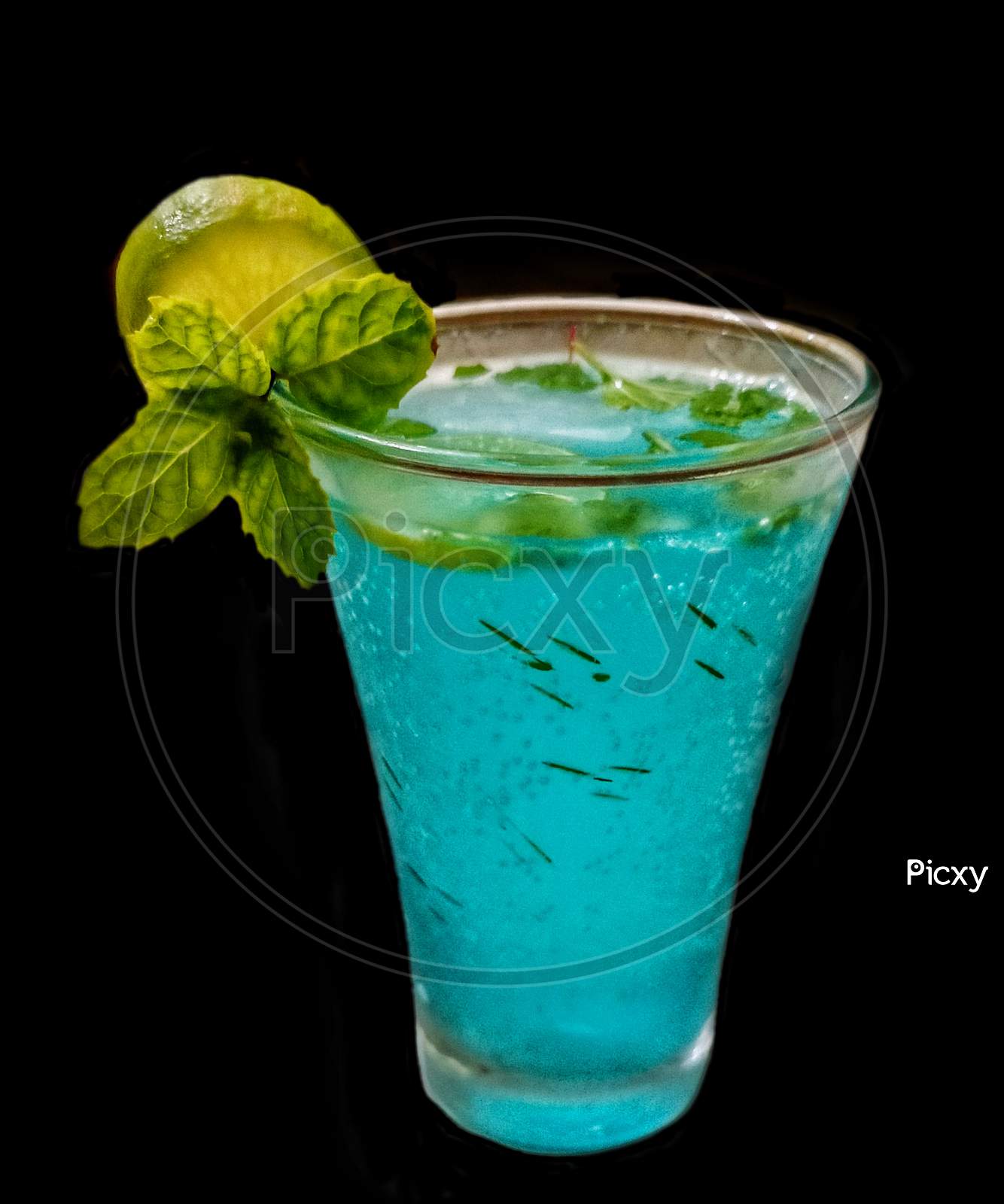 MOJITO, a refreshing drink of summer made up of carbonated water,lemon,mint leaves,salt ,sugar served with ice cubes in glass