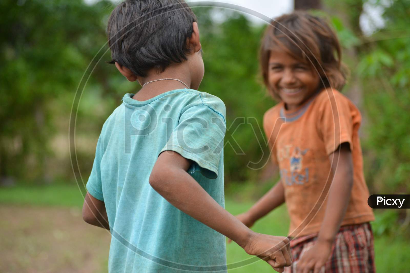 TIKAMGARH, MADHYA PRADESH, INDIA - JULY 12, 2020: Young children smiling and having fun from rural part of India.