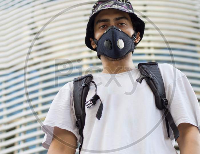 Man In A Protective Face Mask, During Corona Outbreak.