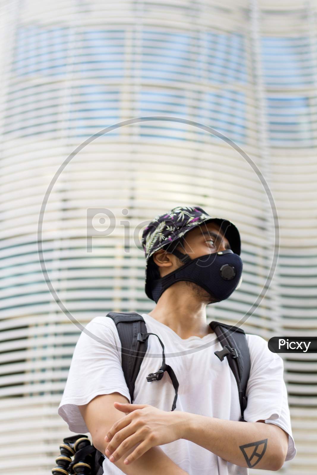 Young Man In A Protective Face Mask, During Corona Outbreak.