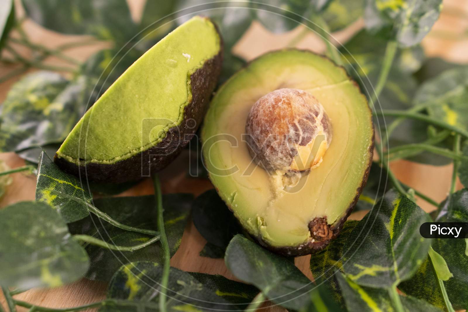 A sliced avocado with the seed