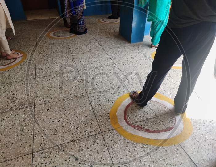 ROHINI, DELHI, INDIA.11 JULY 2020. Circle marked on ground for standing in queue with social distancing for people visit hospital registration counter during Corona virus spread.