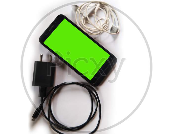 Green screen phone with charger and earphone