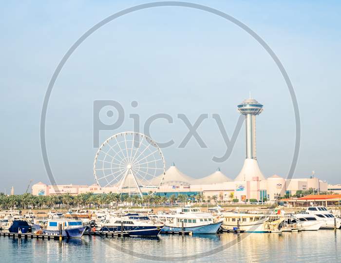 A Far View Of Abu Dhabi Marina Mall With Water Front.