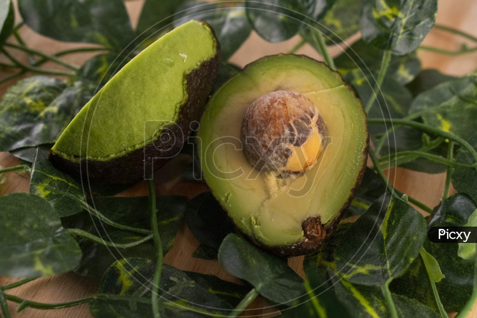 A sliced avocado with the seed