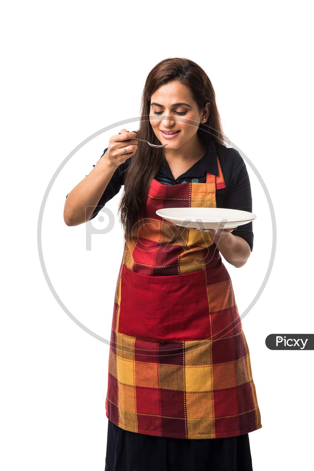 Indian girl holding empty white plate