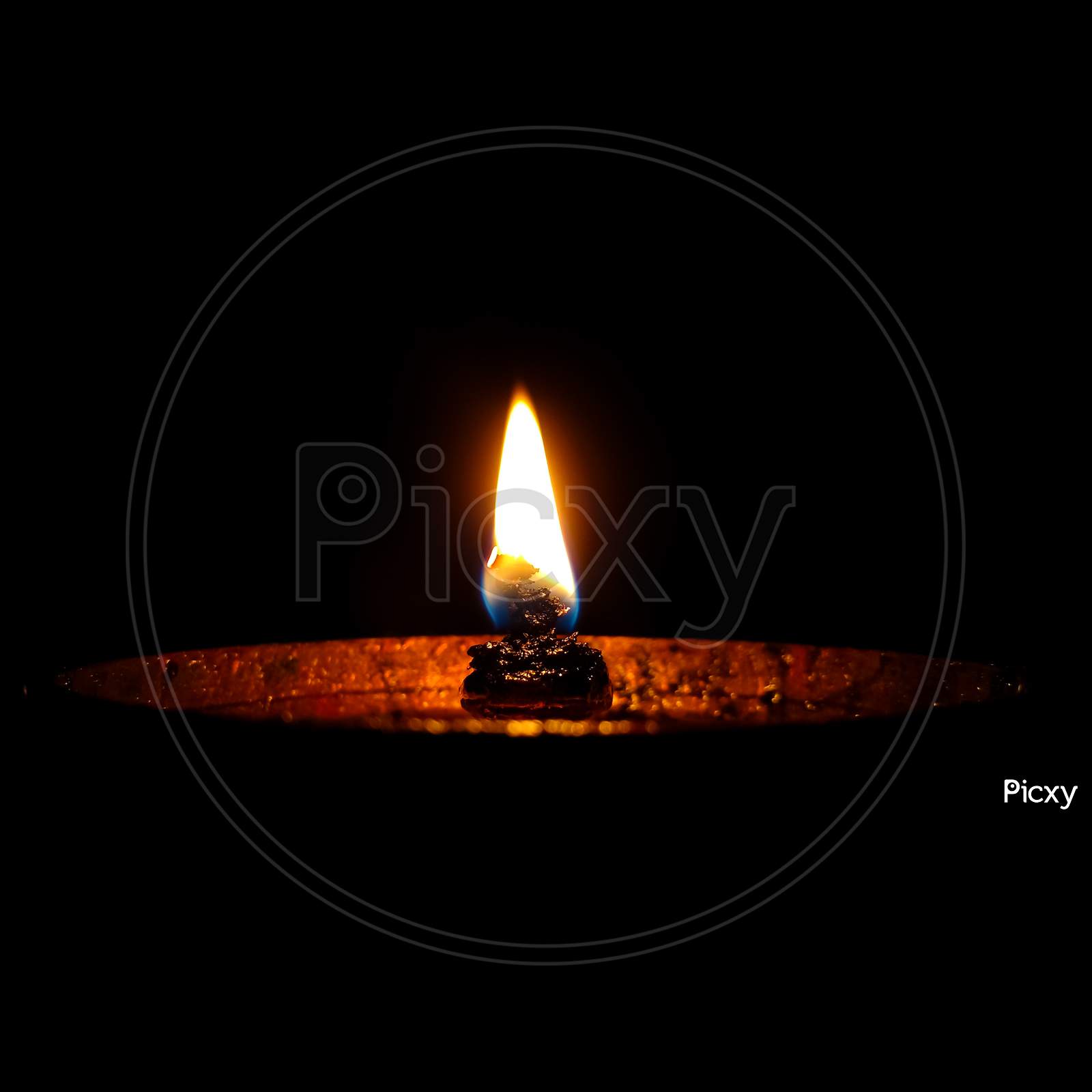 Diya or a candle inside a house