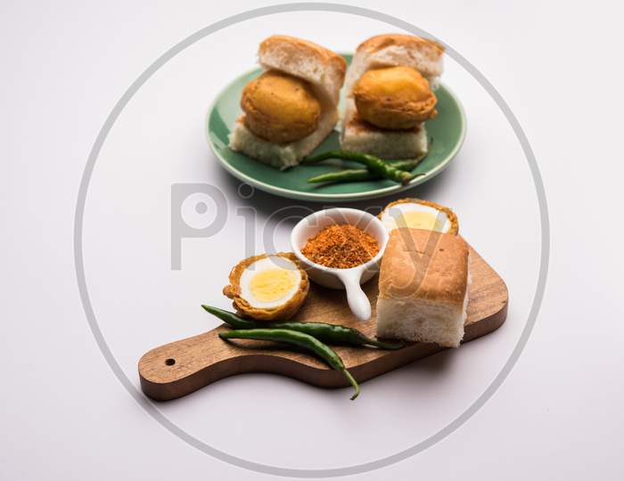 Egg Vada Pav or Anda  Wada Paav / Pao is a non-Vegetarian Fast Food Dish From Maharashtra, India