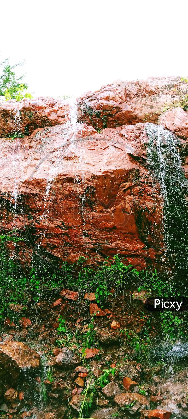 Water Flowing From The Red Rock