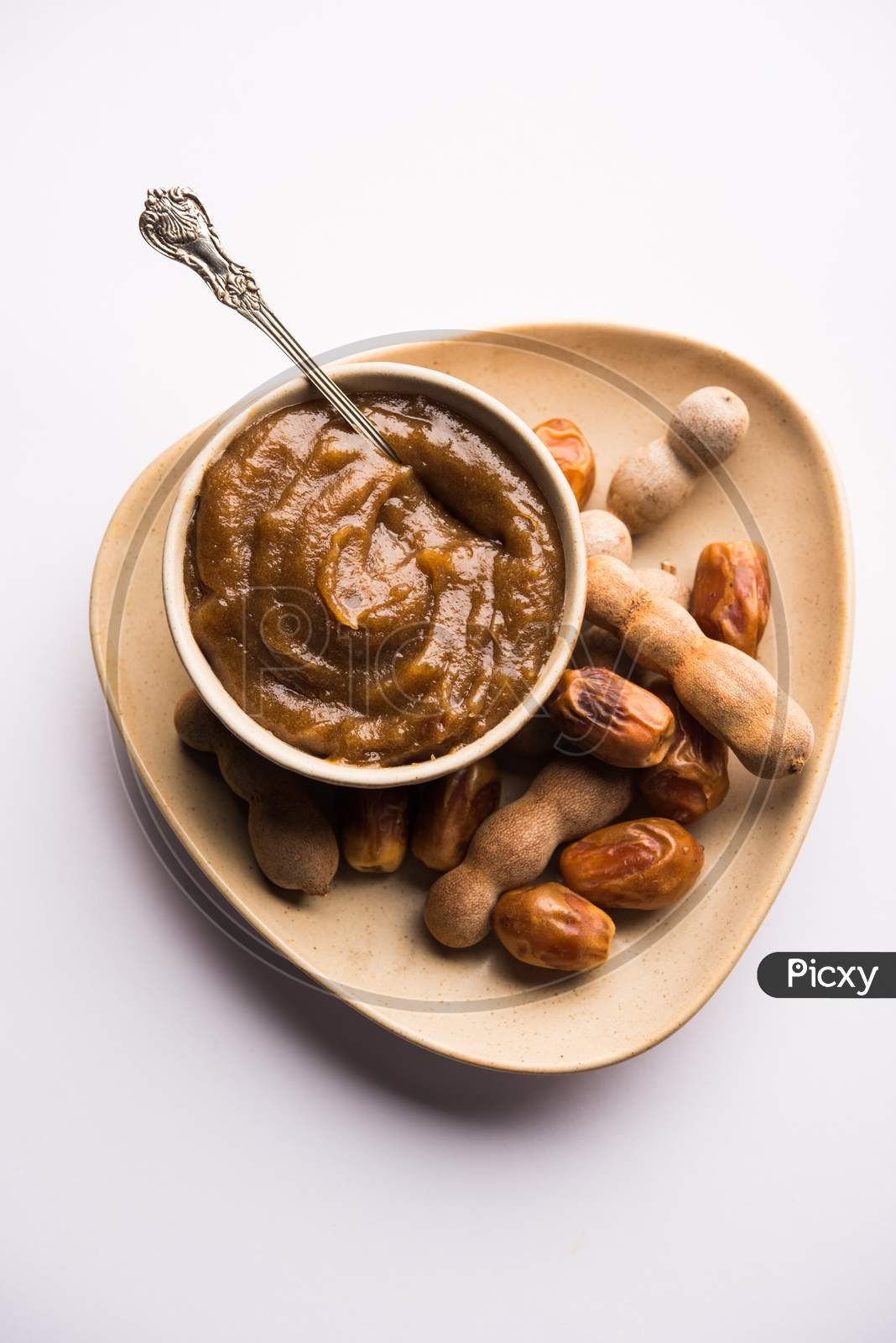 Dates Tamarind Chutney - Khajoor crushed to paste and mixed with Imli or imalee paste, served as a side dish in India