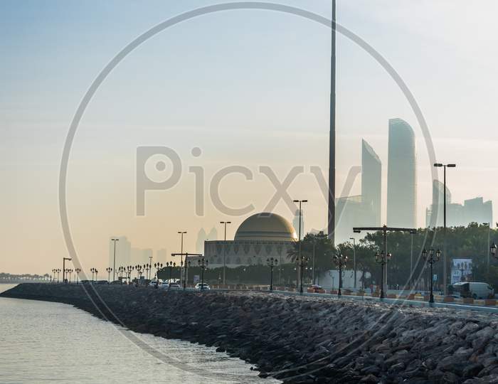 A Far View Of Abu Dhabi Marina Breakwater During Morning Time