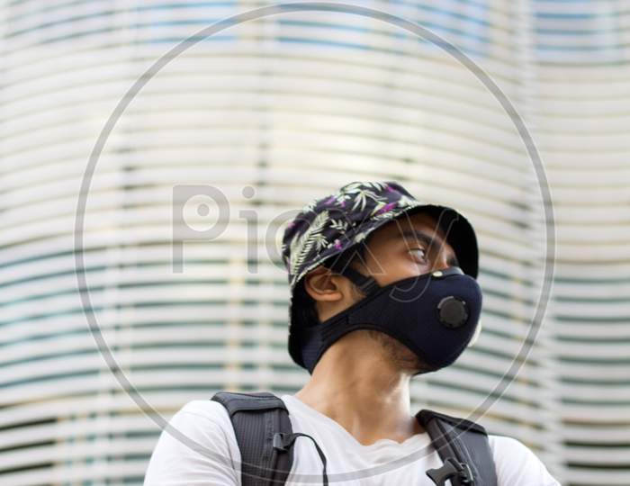 Young Man In A Protective Face Mask, During Corona Outbreak.
