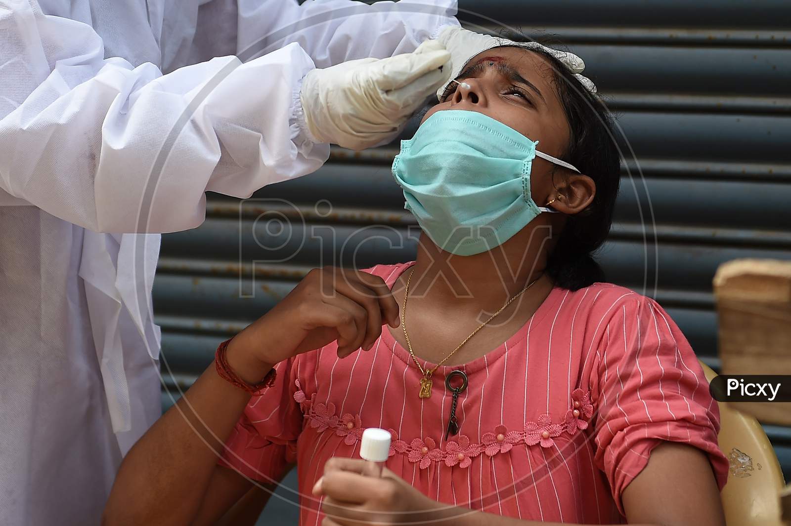 A health worker collects swab samples for Covid-19 testing at a medical camp in Chennai on July 11, 2020