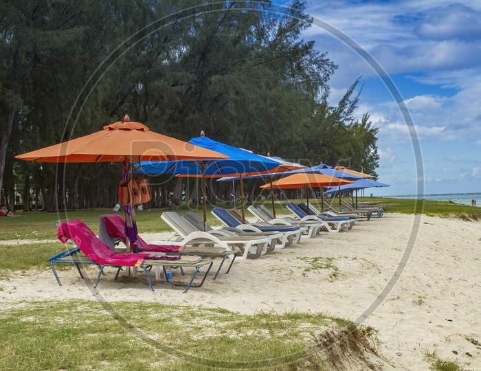 public beach of Flic en Flac with beach umbrellas.