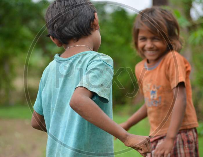 TIKAMGARH, MADHYA PRADESH, INDIA - JULY 12, 2020: Young children smiling and having fun from rural part of India.