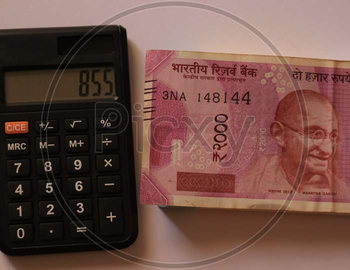 Indian Currency Notes with Calculator isolated with White Background