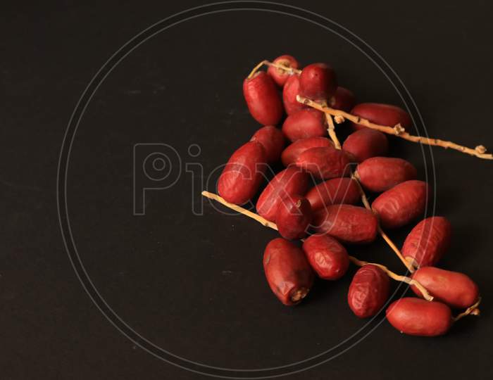 Date Palm Fruits isolated with Black Background
