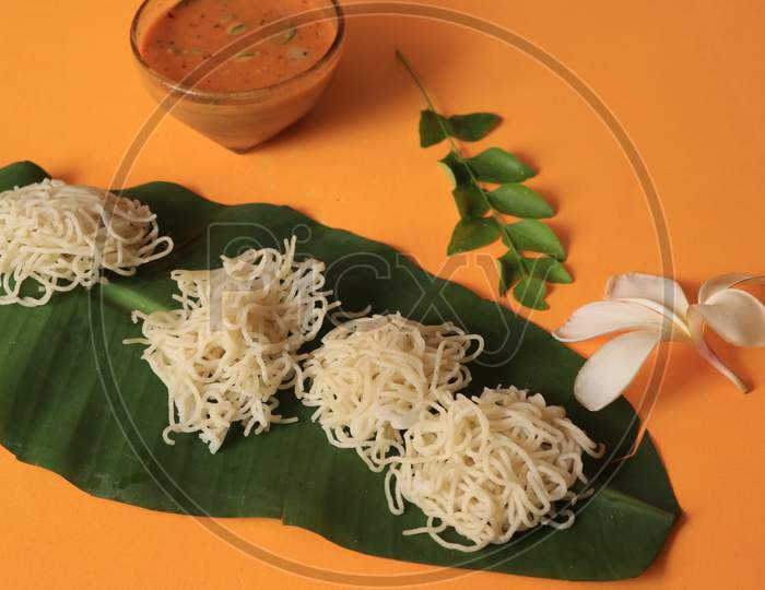 Rice Noodles in Banana Leaf with Curry Isolated with Yellow Background