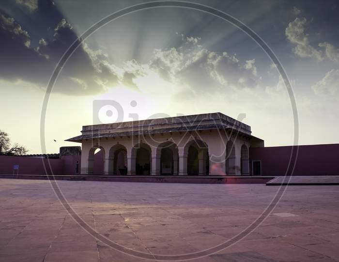 Jaipur, India - October 20, 2012: Medieval Historical Architecture In A Fort Before A Dramatic Sunset