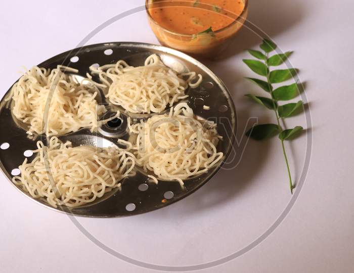 Rice Noodles in Idly Plate with Curry isolated with White Background