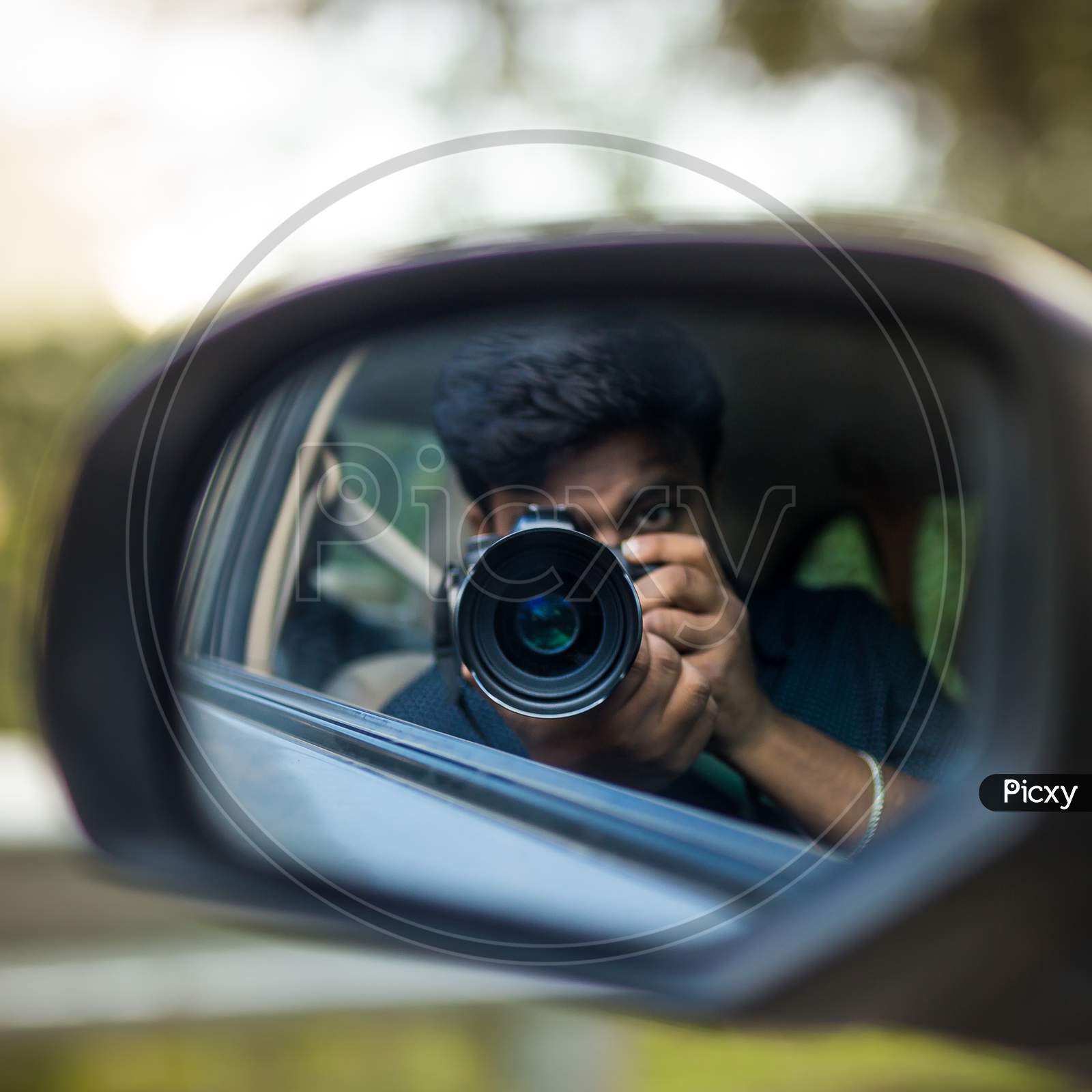 Photographer refection - rear view mirror