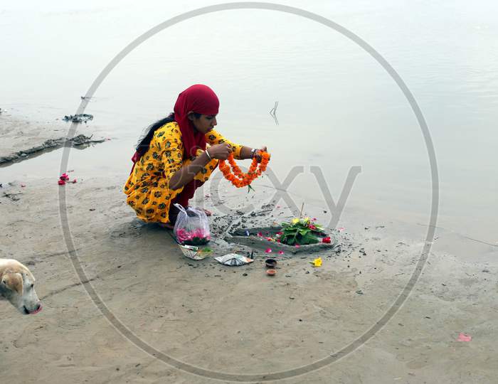 A devotee offer prayers on the first Monday of the holy month of Shravan on the banks of the River Ganga to Lord Shiva in Prayagraj, Uttar Pradesh on July 06, 2020