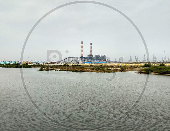 A Large Thermal Power Plant On The Banks Of The Kosasthalaiyar River At Chennai. Two Long Chimneys Are Clearly Visible.