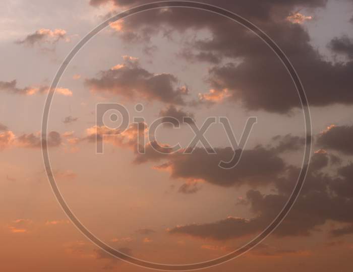 Orange sunset sky with clouds Background